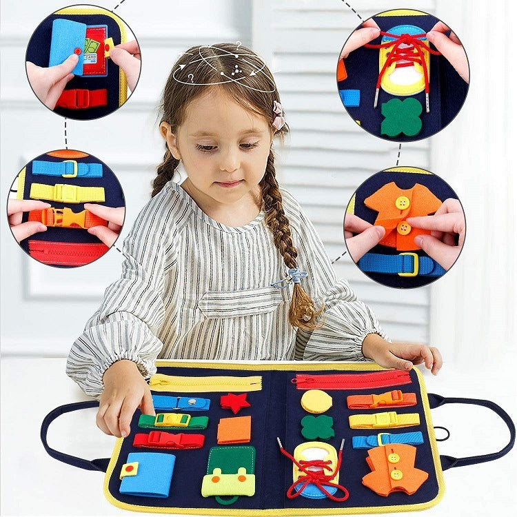 Child playing with busy book sensory board featuring dressing, buttoning, and lacing activities for skill development.